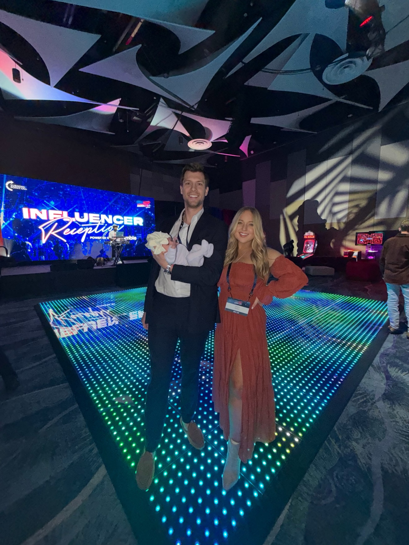 Gentry and his wife at an influencer reception with their baby
